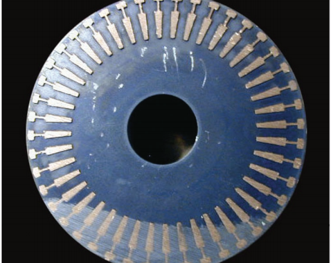 Fig. 13 – Cross-section of rotor for 3-phase motor showing copper fi lling the conductor bar shots.