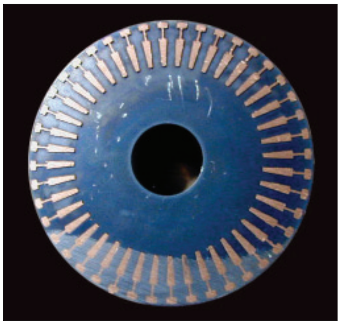 Fig. 9 – Cross-section of rotor showing copper filling the slot openings by the pressure.