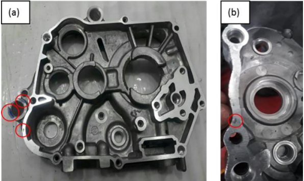Figure 2. Casting defects found in the crank case: (a) pinhole and (b) porosity.