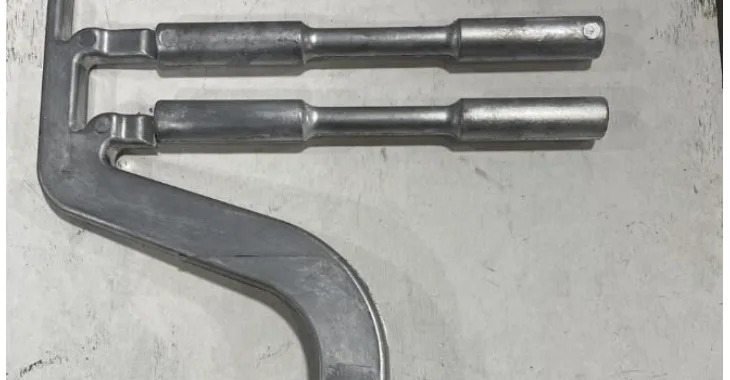 Figure 4.5: Tensile bar die casting in which hot shear specimens were taken from the middle of the reduced section of the tensile bars.