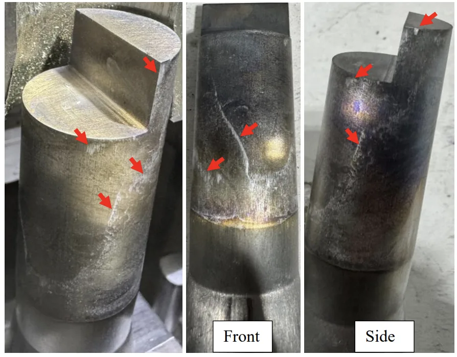 Figure 5.9: A356 core pin ejected at 400°C. Red arrows indicate solder. The core pin has
a diameter of 25mm.
