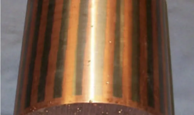 Fig. 6 - Photograph of copper rotor turned on the OD to expose the conductor bars. Trapped air bubbles are not seen in the bars but are clearly visible in the end ring.