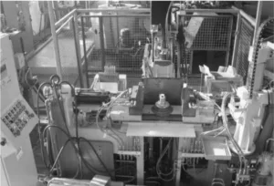 Fig. 2. Permanent mould casting machine for casting single pistons [8]