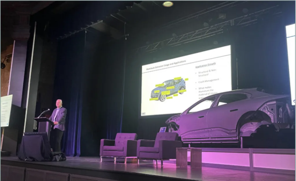 igure 1. Mark Butterfield, president of Metal Exchange Corporation, speaks at the Aluminum Technology Forum in Detroit, which provided a venue for aluminum companies and OEMs to speak on the use of aluminum in vehicles.