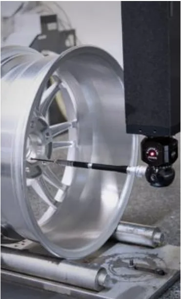 Fig. 4. Quality control of produced alloy wheels using the CMM.