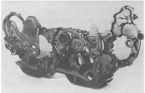 Figure 7, Shown is a sectioned gearbox casting, revealing cored passageways.